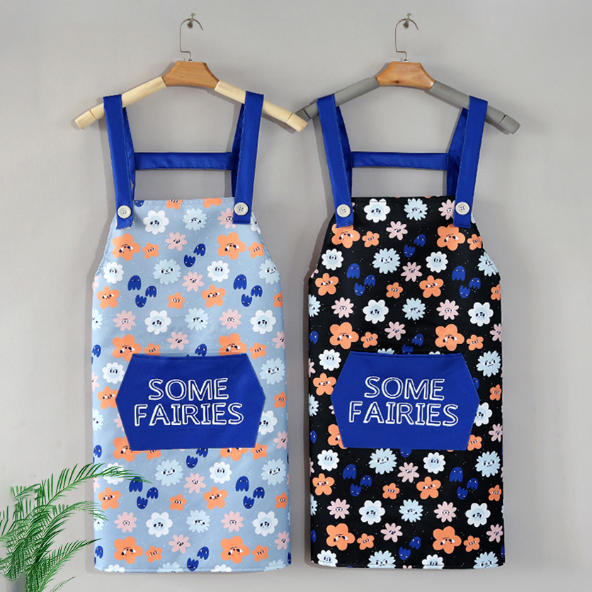 2 Aprons is hanged on. The light color one is on the left, and the deep color one is on the right. Both of them are having the same cartoon flower pattern with text "Some Fairies".